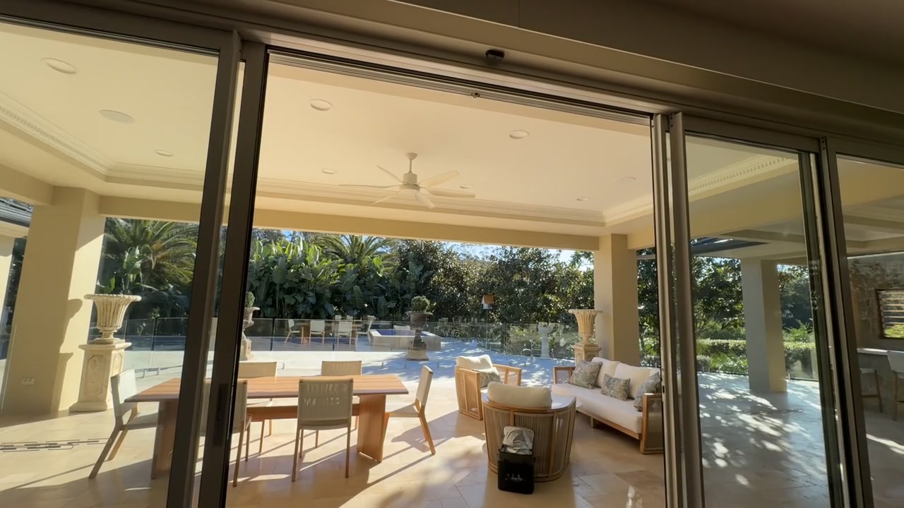 Airla architectural sliding door automation opening onto a furnished Australian terrace