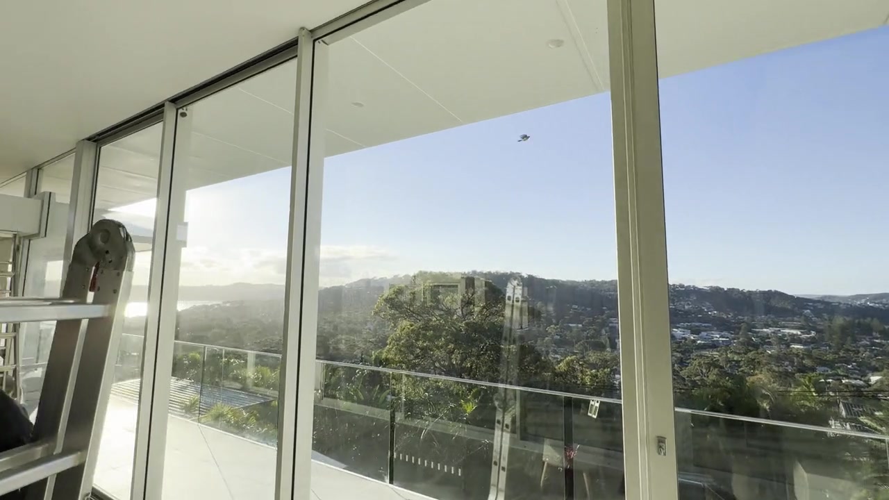 Architectural residence with expansive glazed openings